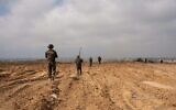 قوات من فرقة غزة تعمل في جنوب قطاع غزة، في صورة نشرها الجيش في 19 مارس 2025. (IDF)