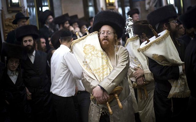 'Let's not lose sight of the true values that Haredim bring to the table: true belief in the Torah as the central force upholding the Jewish people' (illustrative image: dancing in Simhat Torah celebrations in Jerusalem's Mea Shearim neighborhood October, 2012  via Shutterstock)