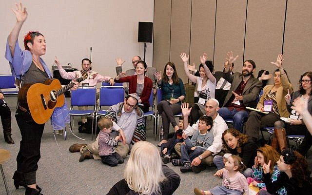 Illustrative: A group meeting for a 'P'sukei D'zimra' morning service before the main Shabbat worship service at the Reform biennial in San Diego, December 14, 2013. (URJ via JTA/File)