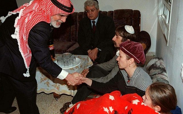 In this Sunday, March 16, 1997 file photo, King Hussein of Jordan shakes the hand of members of the Badayev family in Beit Shemesh who were in mourning after their daughter Shiri was killed by a Jordanian soldier. King Hussein came to Israel to offer condolences to the seven families who lost their daughters in an attack on a class trip. The Jordanian soldier who killed seven Israeli schoolgirls in a 1997 shooting rampage was released Sunday, March 12, 2017, after serving 20 years in prison. (AP PHOTO/GPO/HO, File)