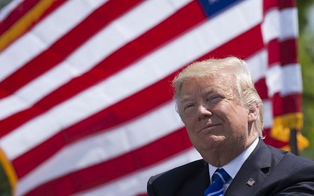US President Donald Trump attends the US Coast Guard Academy commencement ceremony in New London, Connecticut, on May 17, 2017. (AFP Photo/Saul Loeb)