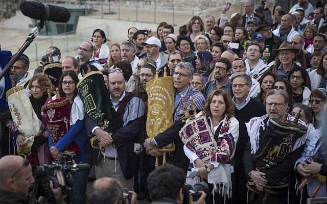 Illustrative: A group of American Conservative and Reform rabbis and the Women of the Wall movement members hold Torah scrolls during a protest march against the government’s failure to deliver a new prayer space, at the Western Wall in Jerusalem Old City, November 2, 2016. (Hadas Parush/Flash90)