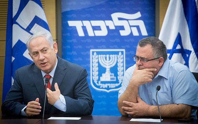 Prime Minister Benjamin Netanyahu, left, with MK David Bitan during a Likud party faction meeting at the Knesset, November 27, 2017. (Miriam Alster/Flash90)