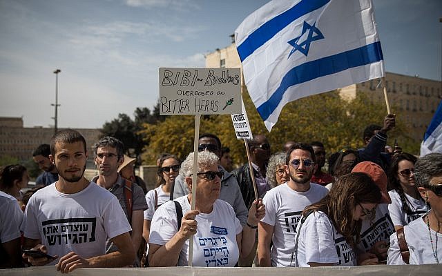 African asylum seekers and Israeli activists protest outside the Prime Minister's Office in Jerusalem, against their deportation, on April 3, 2018. (Hadas Parush/Flash90)