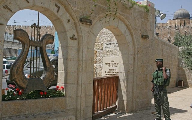An Israeli soldier stands in the City of David (Ir David) in East Jerusalem, next to the Arab neighborhood of Silwan (Matanya Tausig/Flash90/File)