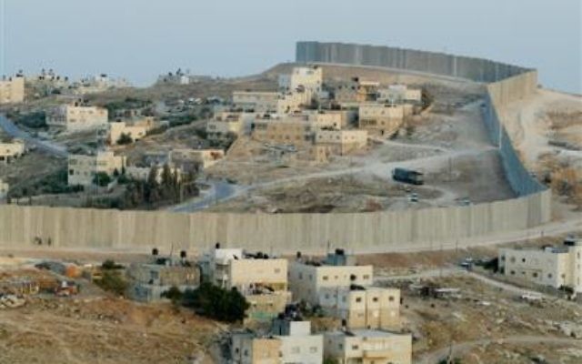 Separation Wall cutting through the village of Abu Dis, just outside Jerusalem. Separation Wall cutting through the village of Abu Dis, just outside Jerusalem.