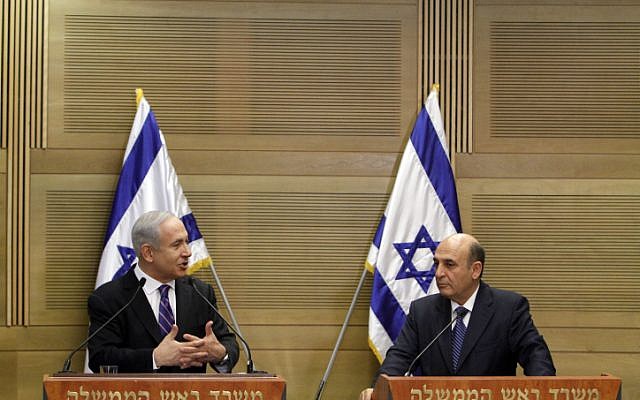 Prime minister Benjamin Netanyahu and Kadima chairman Shaul Mofaz, hold a joint press conference announcing a unity government, on Tuesday (photo credit: Miriam Alster/Flash90) Prime minister Benjamin Netanyahu and Kadima chairman Shaul Mofaz, hold a joint press conference announcing a unity government, on Tuesday (photo credit: Miriam Alster/Flash90)