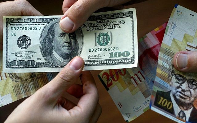 Dollars and shekels (photo credit: Olivier Fitoussi/Flash90)