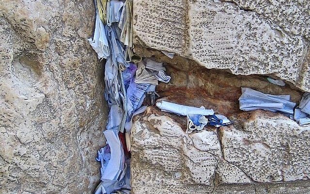 Prayers and notes in the cracks of the Western Wall (photo credit: CC-BY Yarin Kirchen/Wikipedia) Prayers and notes in the cracks of the Western Wall (photo credit: CC-BY Yarin Kirchen/Wikipedia)