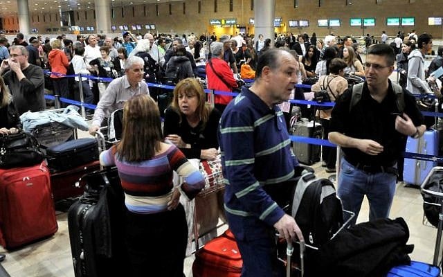 Crowds of travelers wait in line at the Ben Gurion International Airport before the Passover holiday in 2011 (photo credit: Yossi Zaliger/Flash90)