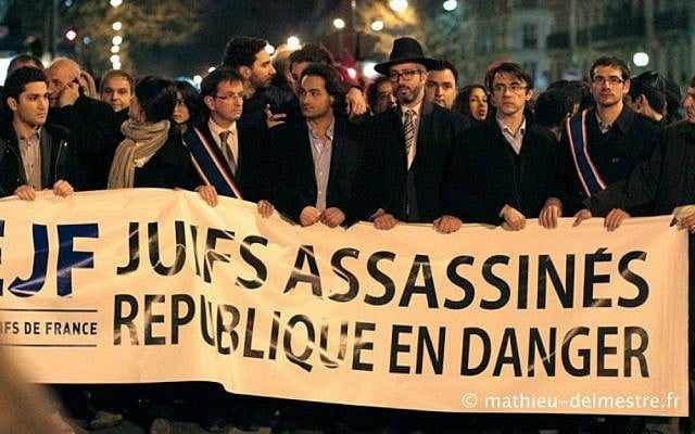 Members of the Union of French Jewish Students demonstrate in Paris in 2013 with a sign that reads, "Jews murdered, republic endangered." (Courtesy of UEJF via JTA) Members of the Union of French Jewish Students demonstrate in Paris in 2013 with a sign that reads, "Jews murdered, republic endangered." (Courtesy of UEJF via JTA)