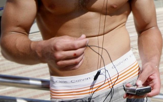 Illustrative photo of a cellphone...and some other stuff. (photo credit: Miriam Alster/Flash90)