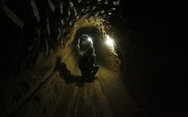 A Palestinian worker inside a smuggling tunnel, beneath the Egyptian-Gaza border in the southern Gaza Strip, in February 2013 (photo credit: Abed Rahim Khatib/Flash90) A Palestinian worker inside a smuggling tunnel, beneath the Egyptian-Gaza border in the southern Gaza Strip, in February 2013 (photo credit: Abed Rahim Khatib/Flash90)