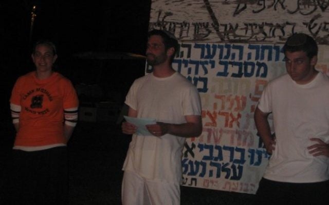 The author (right) running a Zionist night-activity in Camp Moshava, Wild Rose in July of 2008. (Doni Kandel)