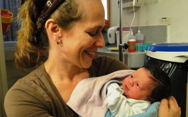 The author with her first grandchild, just hours old. The author with her first grandchild, just hours old.