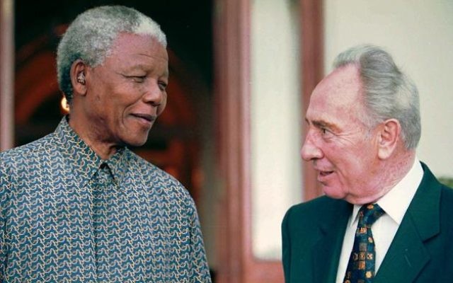 South African President Nelson Mandela, left, talks to former Israeli Prime Minister Shimon Peres, in front of President Mandela's official residence in Cape Town, Sunday, Oct. 20 1996. (AP PHOTO/Sasa Kralj) South African President Nelson Mandela, left, talks to former Israeli Prime Minister Shimon Peres, in front of President Mandela's official residence in Cape Town, Sunday, Oct. 20 1996. (AP PHOTO/Sasa Kralj)