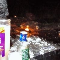 Tall memorial candles flicker alongside the underground tomb of Mishnaic-era scholar, R' Yehuda Bar Ilai, near Safed, Israel.