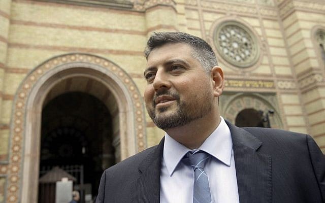In this picture taken Friday May 30 2014, Csanad Szegedi stands in front of a Budapest Synagogue. (photo credit: AP Photo/Peter Kohalmi)