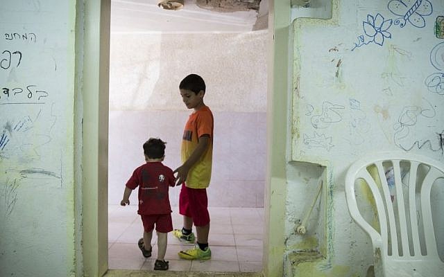 Children are seen in a bomb shelter of an apartment building in Ashkelon, southern Israel, on the third day of Operation Protective Edge, Thursday, July 10, 2014. (photo credit: Hadas Parush/Flash90)