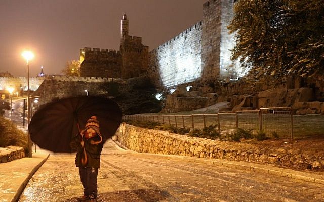 A young girl walks with an umbrella near the walls of the Old City of Jerusalem a winter storm hits Israel, January 07, 2015. (photo credit: Nati Shohat/FLASH90) A young girl walks with an umbrella near the walls of the Old City of Jerusalem a winter storm hits Israel, January 07, 2015. (photo credit: Nati Shohat/FLASH90)