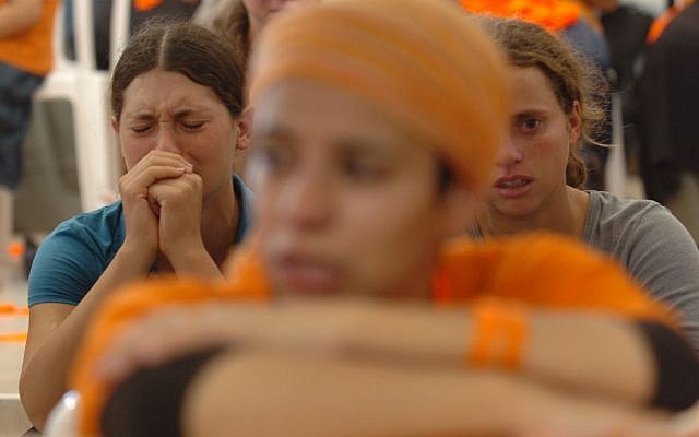 Settlers cry and pray during the disengagement from Gush Katif on August 18, 2005 (photo credit: Nati Shohat/Flash90) Settlers cry and pray during the disengagement from Gush Katif on August 18, 2005 (photo credit: Nati Shohat/Flash90)