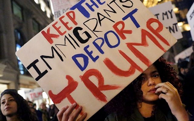 A crowd marches from Union Square to Trump Tower in protest of new Republican president-elect Donald Trump on November 12, 2016 in New York, (Yana Paskova/Getty Images/AFP)
