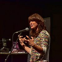 Shaindy Esienberg at the Shabbat Project's Great Challah bake speaking about women and their mirrors