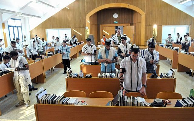Illustrative: Religious Zionist students praying at a hesder yeshiva. (The hesder program which combines advanced Talmudic studies with military service in the Israel Defense Forces, usually within a Religious Zionist framework.) (Yossi Zeliger/Flash90)