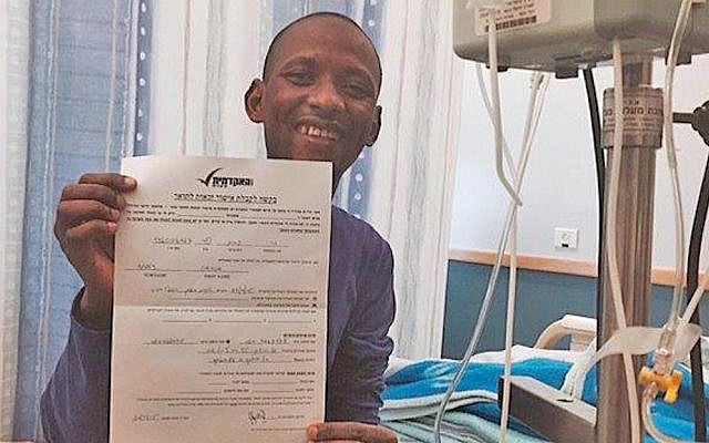 Gassim Barry receives news of his eligibility for BA certification while hospitalized for cancer treatment (courtesy) Gassim Barry receives news of his eligibility for BA certification while hospitalized for cancer treatment (courtesy)