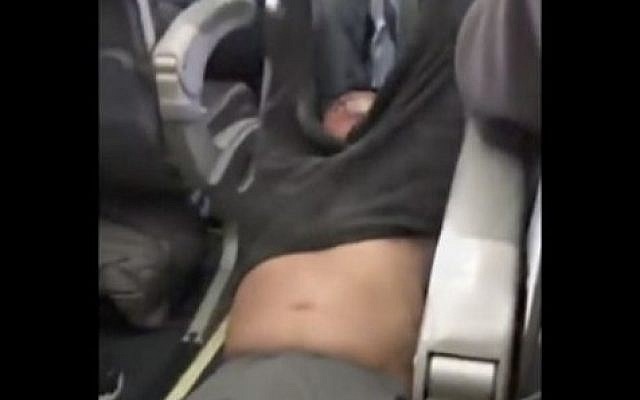 This Sunday, April 9, 2017, image shows a passenger being removed from a United Airlines flight in Chicago. Video of police officers dragging the passenger from an overbooked United Airlines flight sparked an uproar Monday on social media. (Audra D. Bridges via AP) This Sunday, April 9, 2017, image shows a passenger being removed from a United Airlines flight in Chicago. Video of police officers dragging the passenger from an overbooked United Airlines flight sparked an uproar Monday on social media. (Audra D. Bridges via AP)