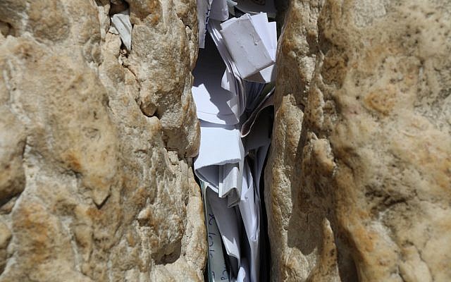 Letters in the spaces between stones of the Western Wall in Jerusalem (iStock)