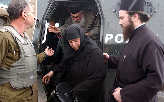 An Israeli soldier helps to smuggle out a priest and nun from the Church of the Nativity in Bethlehem on Sunday April 7, 2002. Israeli soldiers have been outside the church for a week long standoff with Palestinian gunmen. Photo by Flash90. An Israeli soldier helps to smuggle out a priest and nun from the Church of the Nativity in Bethlehem on Sunday April 7, 2002. Israeli soldiers have been outside the church for a week long standoff with Palestinian gunmen. Photo by Flash90.