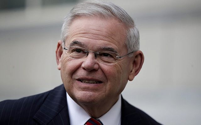 U.S. Sen. Bob Menendez answers a question from a reporter before entering the Martin Luther King Jr. Federal Courthouse for his federal corruption trial, Thursday, Nov. 16, 2017, in Newark, N.J. Jury deliberations continued on Thursday morning. (AP Photo/Julio Cortez)