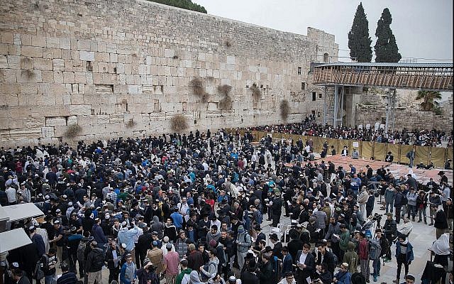 Illustrative: Jews gather at the Western Wall in Jerusalem's Old City to pray for rain, on December 28, 2017. (Flash90) Illustrative: Jews gather at the Western Wall in Jerusalem's Old City to pray for rain, on December 28, 2017. (Flash90)