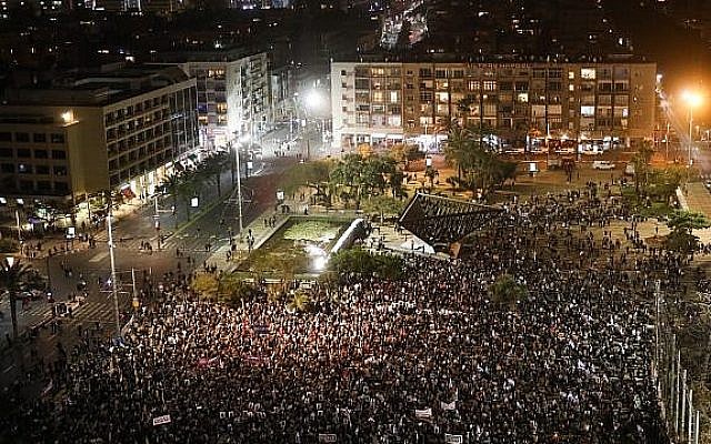 African asylum seekers and activists protest against plans to deport migrants at Rabin Square in Tel Aviv on March 24, 2018. (Miriam Alster/Flash90) African asylum seekers and activists protest against plans to deport migrants at Rabin Square in Tel Aviv on March 24, 2018. (Miriam Alster/Flash90)