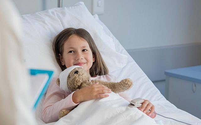 Illustrative. Girl in hospital bed. (iStock)
