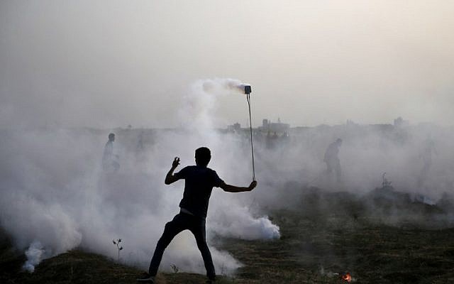 Illustrative image of a Palestinian protester at a demonstration along the border between Israel and the Gaza Strip, east of Gaza City, on May 25, 2018. (AFP/Mohammed Abed)
