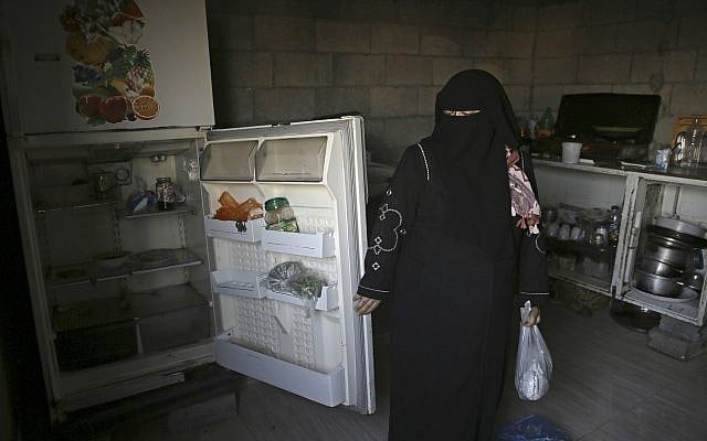Samia Hassan shows her family's nearly empty refrigerator in Gaza City, May 31, 2018. (AP Photo/Adel Hana) Samia Hassan shows her family's nearly empty refrigerator in Gaza City, May 31, 2018. (AP Photo/Adel Hana)