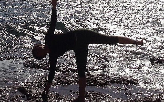 Half moon by water yoga pose. (Courtesy, Ruthi Soudak)