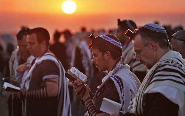 Jewish worshippers wrapped in prayer shawls, participate in the special "Blessing of the Sun" prayer at sunrise on the Eitam Hilltop near the West Bank Jewish settlement of Efrata, Wednesday, April 8, 2009. Devout Jews around the world on Wednesday observed a ritual performed only once every 28-years, saying their morning prayers under the open sky in the "blessing of the sun", called the Birkat Hachamah in Hebrew. (AP Photo/ Kevin Frayer) Jewish worshippers wrapped in prayer shawls, participate in the special "Blessing of the Sun" prayer at sunrise on the Eitam Hilltop near the West Bank Jewish settlement of Efrata, Wednesday, April 8, 2009. Devout Jews around the world on Wednesday observed a ritual performed only once every 28-years, saying their morning prayers under the open sky in the "blessing of the sun", called the Birkat Hachamah in Hebrew. (AP Photo/ Kevin Frayer)