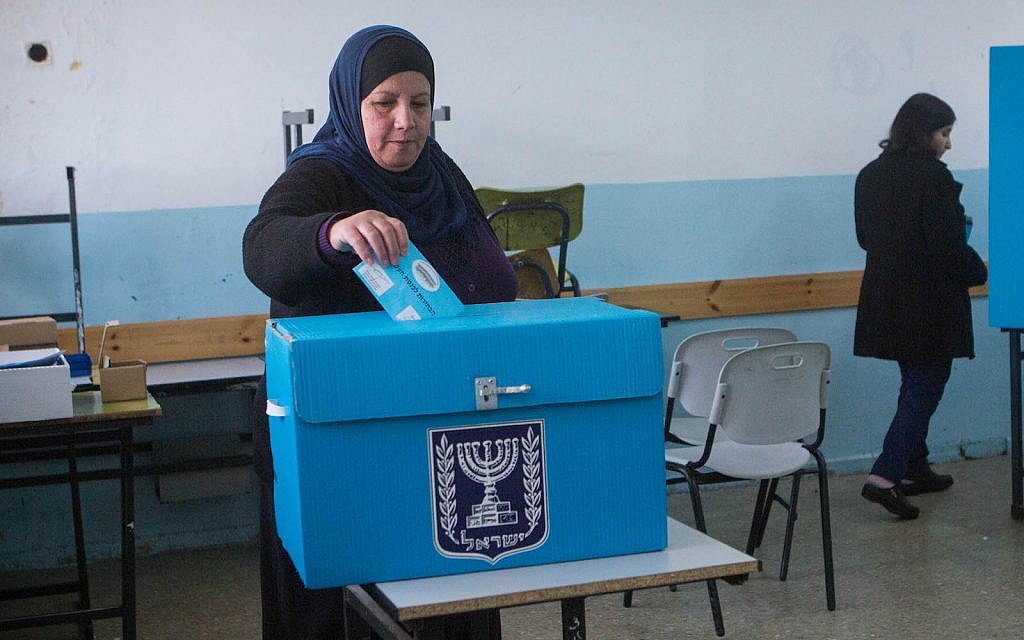 Israeli-Arabs cast their votes at a polling station in the Arab town of Beit Safafa, on March 17, 2015, in the Israeli general elections for the 20th parliament. (FLASH90/Miriam Alster)