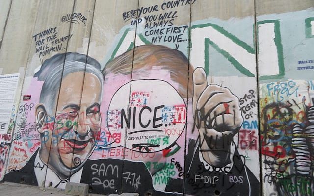 Illustrative. The Palestinian side of the separation wall in Bethlehem has graffiti in Arabic and English, June 25, 2018. (Ron Kampeas)