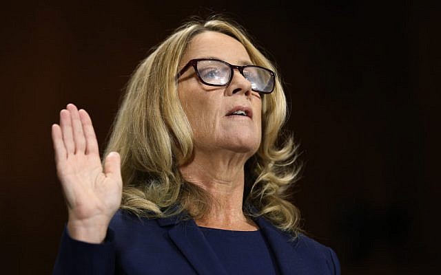 Christine Blasey Ford is sworn in before the Senate Judiciary Committee, Thursday, Sept. 27, 2018 on Capitol Hill in Washington.  The Senate Judiciary Committee will hear from Supreme Court nominee Brett Kavanaugh and Christine Blasey Ford, the woman who says he sexually assaulted her. (Michael Reynolds/Pool Image via AP)