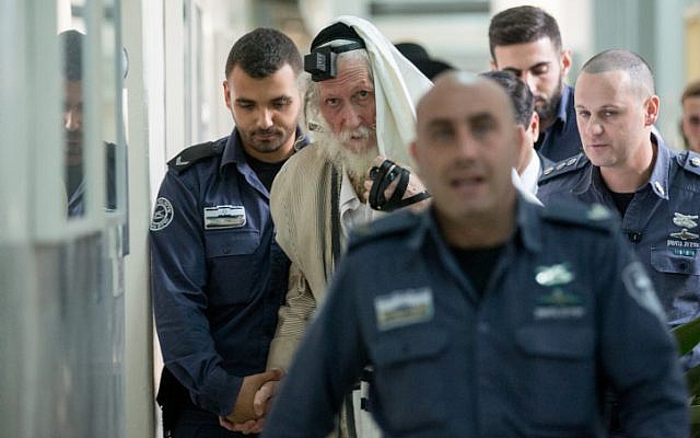 Eliezer Berland covers himself with his tallit (prayer shawl) at the Magistrate Court in Jerusalem, as he is put on trial for sexual assault charges, on November 17, 2016. (Yonatan Sindel/ Flash90) Eliezer Berland covers himself with his tallit (prayer shawl) at the Magistrate Court in Jerusalem, as he is put on trial for sexual assault charges, on November 17, 2016. (Yonatan Sindel/ Flash90)