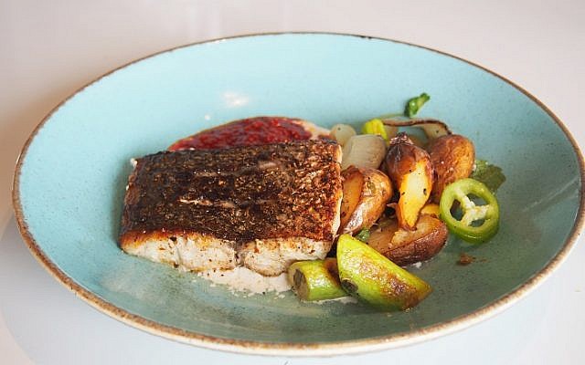 Meagre fillet a la plancha with ratte potatoes and seared baby zucchini on almonds tahini and chermoula.