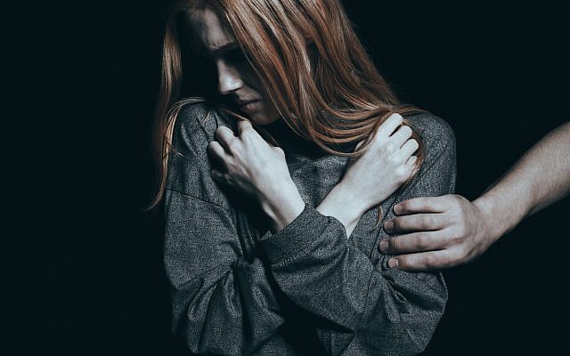 Illustrative. Modestly dressed woman subject to unwanted physical contact. (iStock)