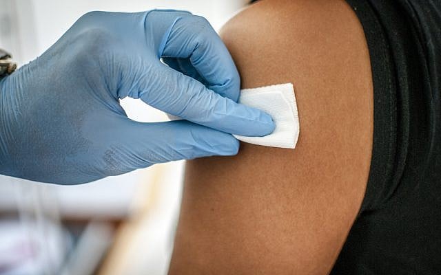 Illustrative. Disinfecting the skin of patient before a vaccination. (iStock)