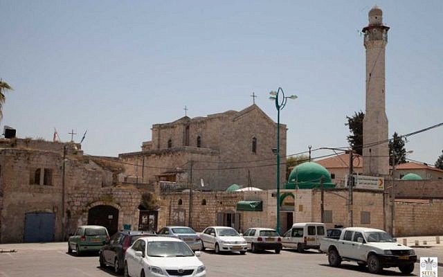 Lod's Church of St. George and Great Mosque, located across the street from an Indian Synagogue