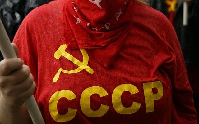 Illustrative: A red T-shirt with the acronym and symbol of the former Soviet Union. (AP Photo/Misha Japaridze) Illustrative: A red T-shirt with the acronym and symbol of the former Soviet Union. (AP Photo/Misha Japaridze)