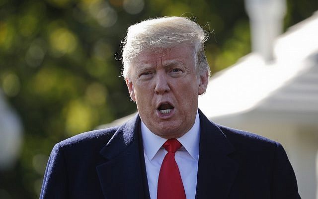 US President Donald Trump stops to talk to the media before walking across the South Lawn of the White House in Washington, October 22, 2018, to board Marine One helicopter for a short trip to Andrews Air Force Base, Maryland., en route to Houston. (AP Photo/Pablo Martinez Monsivais) US President Donald Trump stops to talk to the media before walking across the South Lawn of the White House in Washington, October 22, 2018, to board Marine One helicopter for a short trip to Andrews Air Force Base, Maryland., en route to Houston. (AP Photo/Pablo Martinez Monsivais)